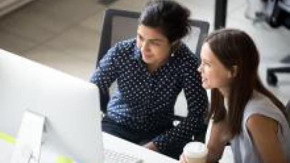 Colleagues looking at a computer