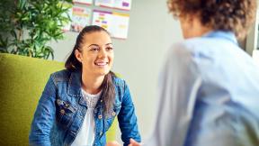 Smiling in a meeting