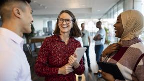 Smiling people talking in a group