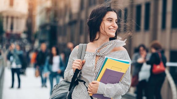 A student on a busy street.