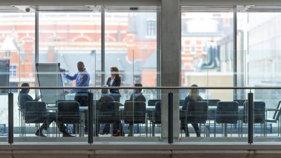 Senior leaders in a meeting in a boardroom