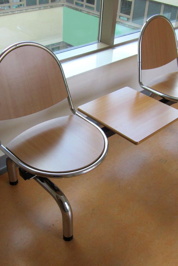 A seating area in a hospital corridor.